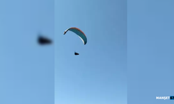 Mahallenin üstünden geçen paraşütçüyü çaya çağırdı...